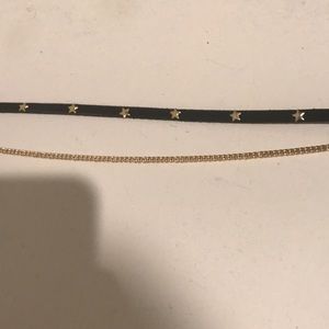 Black choker with gold star studs & a gold chain